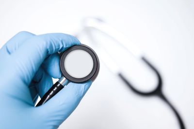 Close-up of hand holding stethoscope