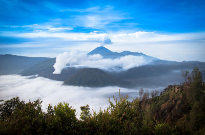 View of volcanic landscape against cloudy sky