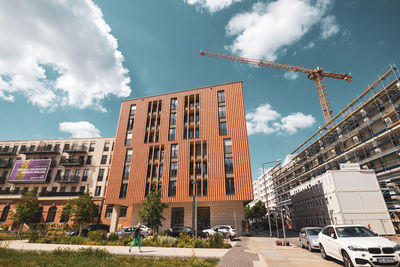 Low angle view of buildings and street against sky