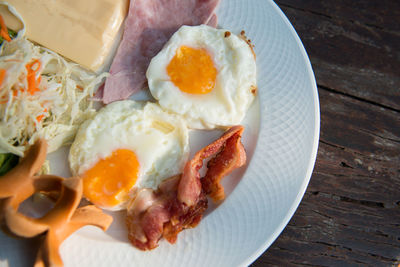 High angle view of breakfast on wooden table