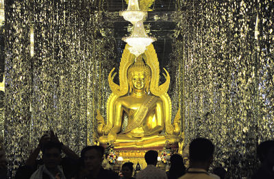 Statue in temple against building