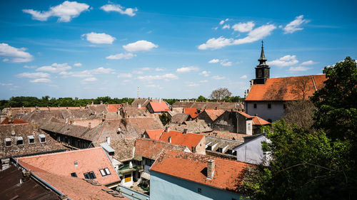Old town by buildings against sky