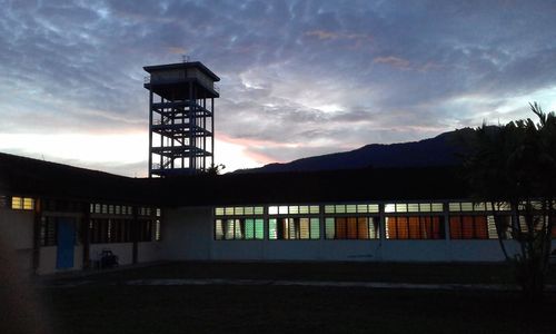 Silhouette of water tower against sky