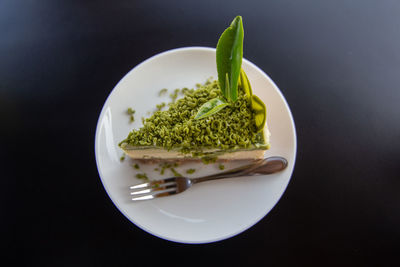 High angle view of chopped vegetables on table against black background