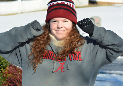 Portrait of smiling woman in snow