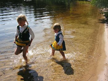 Full length of boy standing on shore