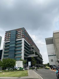 Low angle view of modern buildings against sky