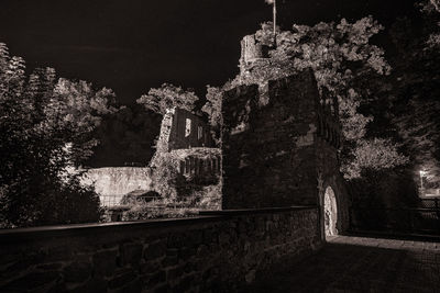 Low angle view of old building against sky at night