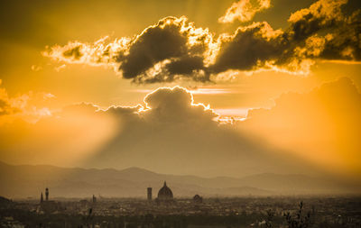 Panoramic view of city against sky during sunset