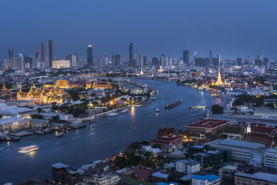 High angle view of illuminated buildings in city