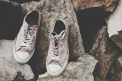 High angle view of shoes on rock