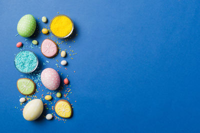 Directly above shot of easter eggs on blue background