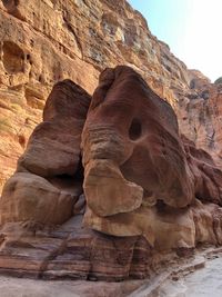 Low angle view of rock formation against sky