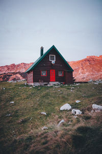 House on field against sky
