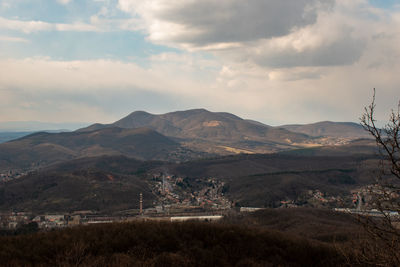 Scenic view of landscape and mountains against sky