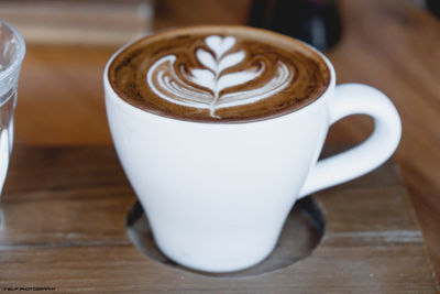 Close-up of cappuccino on table