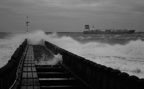 Scenic view of stormy sea against sky