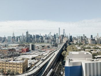 High angle view of buildings in city against sky