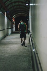 Rear view of man walking on street