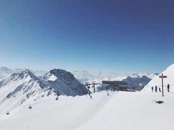 View of snowcapped mountain against clear blue sky