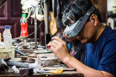 Portrait of man working on table