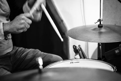 Midsection of man playing piano