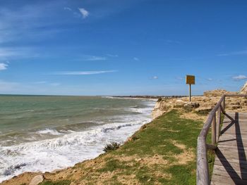 Scenic view of sea against blue sky