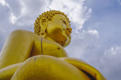 Low angle view of statue against sky