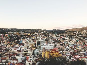 High angle view of illuminated city against sky