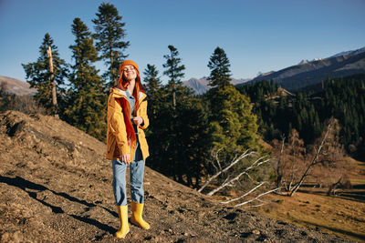 Portrait of woman standing on field