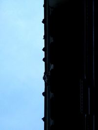 Low angle view of building against clear blue sky