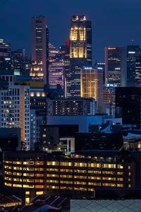 Illuminated buildings in city at night