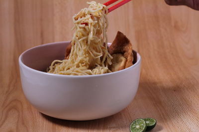 Close-up of noodles in bowl on table