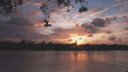 Scenic view of lake against sky during sunset