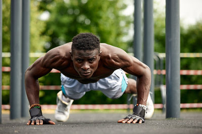 Side view of man exercising in gym