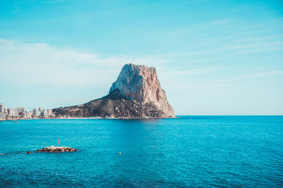 Scenic view of sea against blue sky