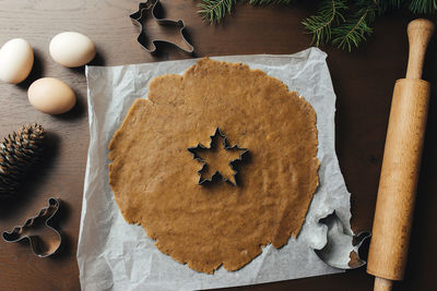 Cooking christmas gingerbread cookies on the kitchen. high quality photo