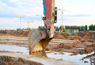 Construction site on field against sky