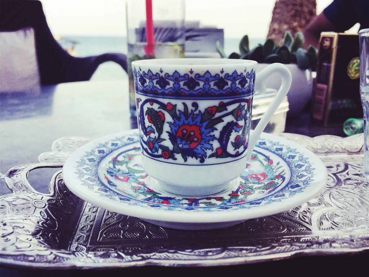 coffee cup, saucer, design, floral pattern, still life, coffee - drink, refreshment, table, drink, food and drink, indoors, close-up, freshness, decoration, creativity, multi colored, focus on foreground, arrangement, non-alcoholic beverage, serving size