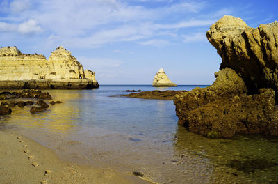 Scenic view of sea against cloudy sky