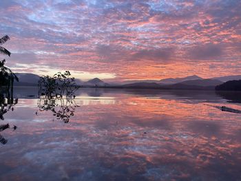 Scenic view of lake against sky during sunset