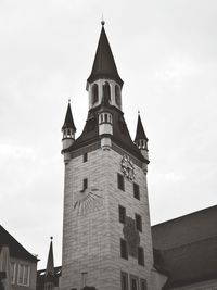 Low angle view of bell tower against sky