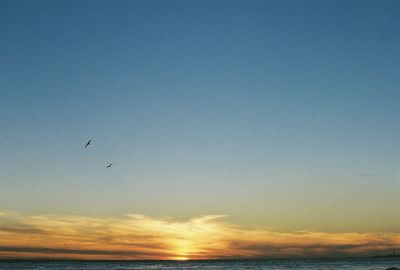 Scenic view of sea against sky at sunset