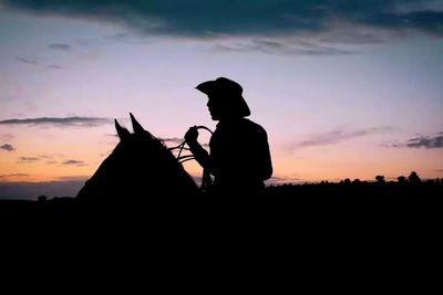 Silhouette of people at sunset