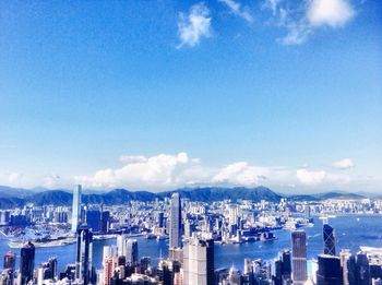 Cityscape against cloudy sky