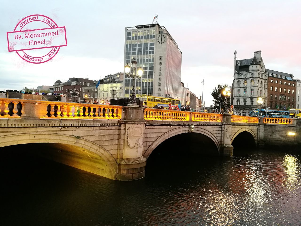 ARCH BRIDGE OVER RIVER IN CITY