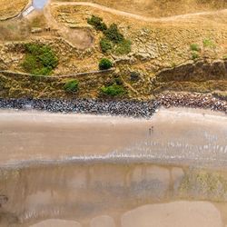 High angle view of beach by field