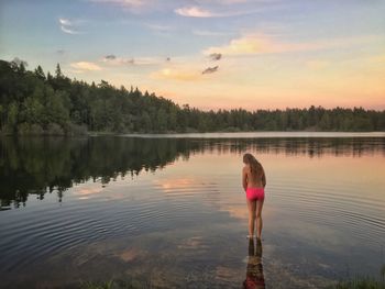 Girl standing in lake