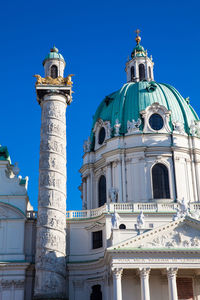 Low angle view of building against clear blue sky