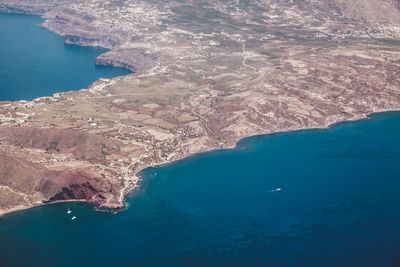 Aerial view of blue sea and landscape on sunny day